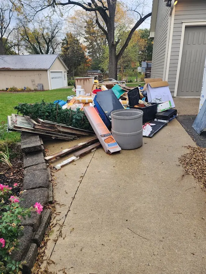 Dumpster being loaded with debris for 3 Yard Dumpster Rental in Tybee Island